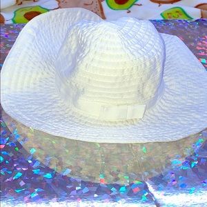 Cute white hat with bow good to wear to the beach